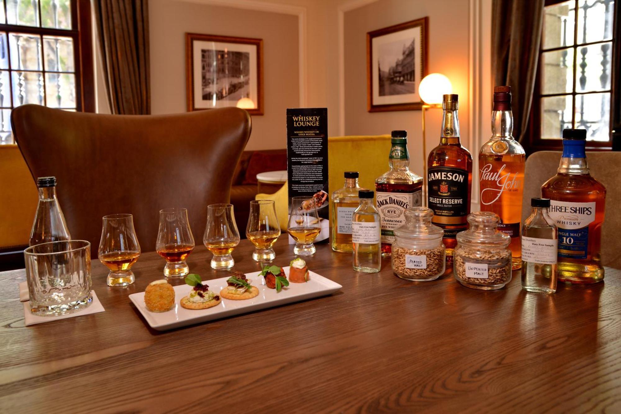 Taj Cape Town Hotel Exterior photo A whisky tasting session